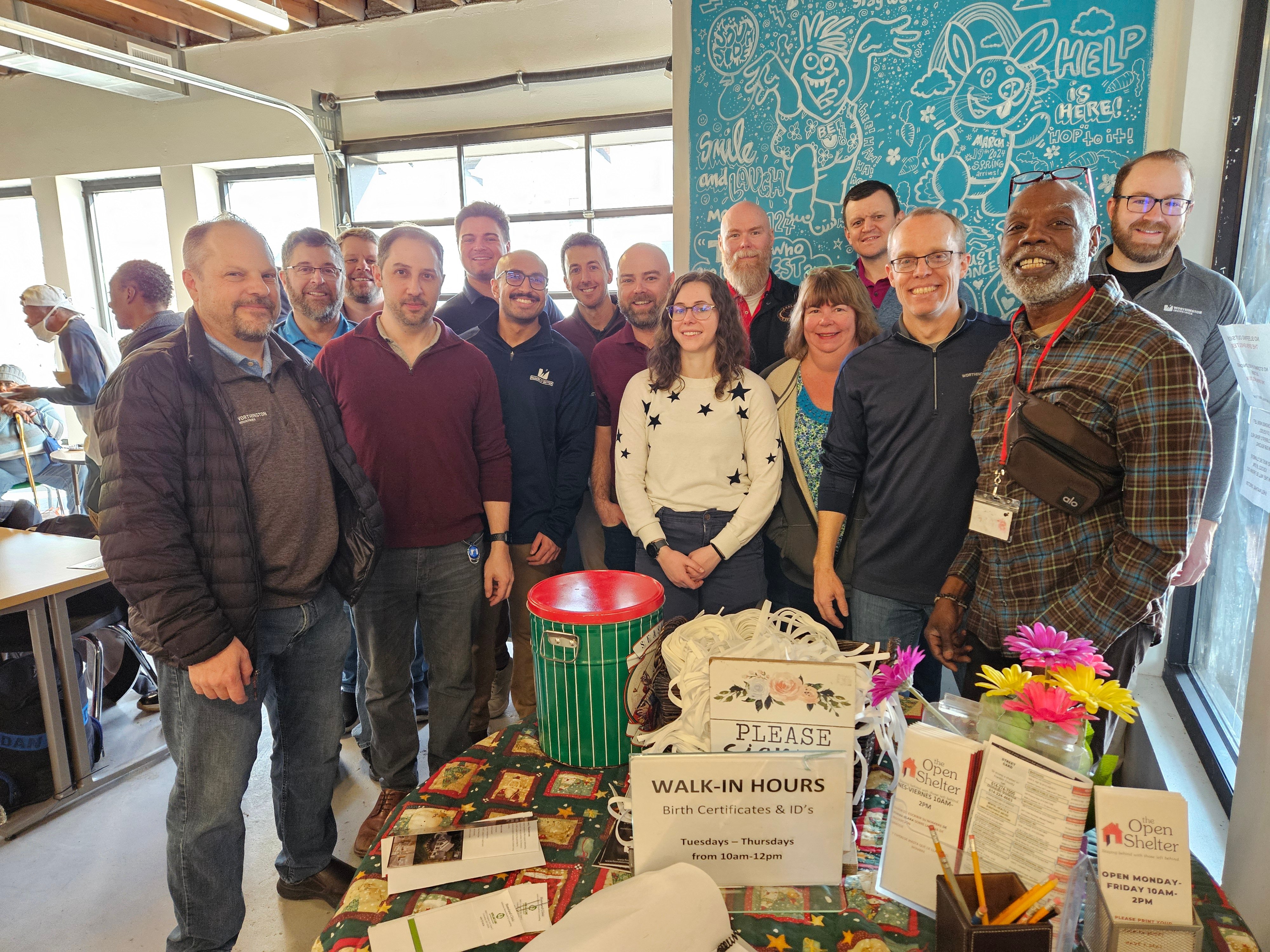 Worthington Steel employees volunteering at The Open Shelter, demonstrating the company's commitment to community service.