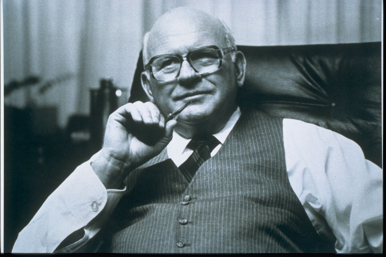 Worthington Steel founder, John H. McConnell, sitting in a chair.