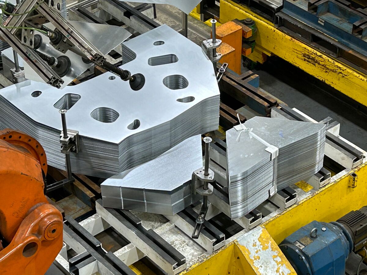 Laser-welded steel blanks being formed and stacked at Worthington Steel’s TWB facility.