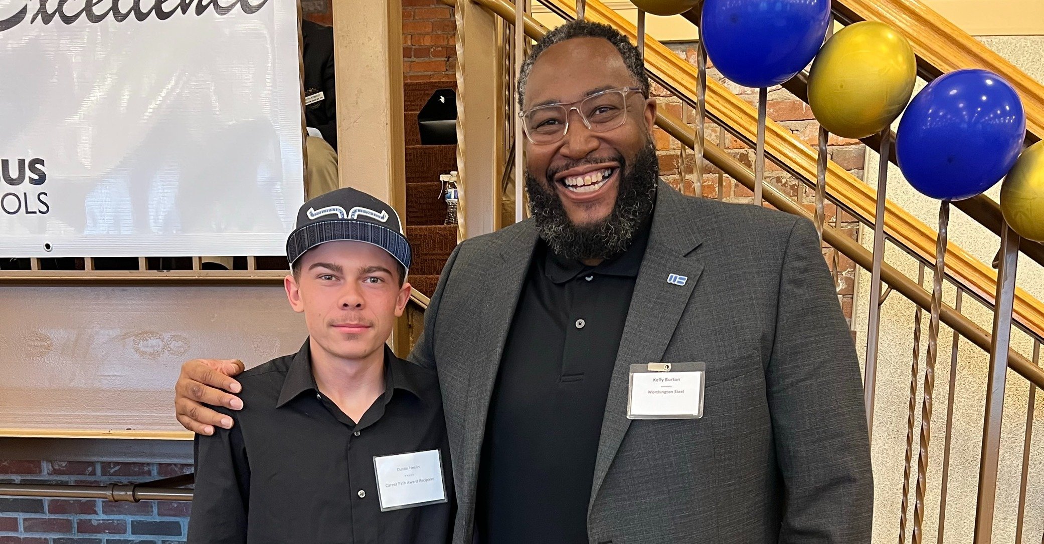 Worthington Steel corporate employee with a mentee at a networking event.