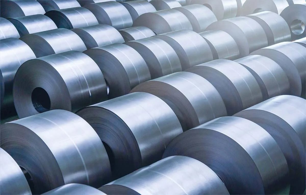 A collection of many galvanized steel coils, characterized by their reflective surface.