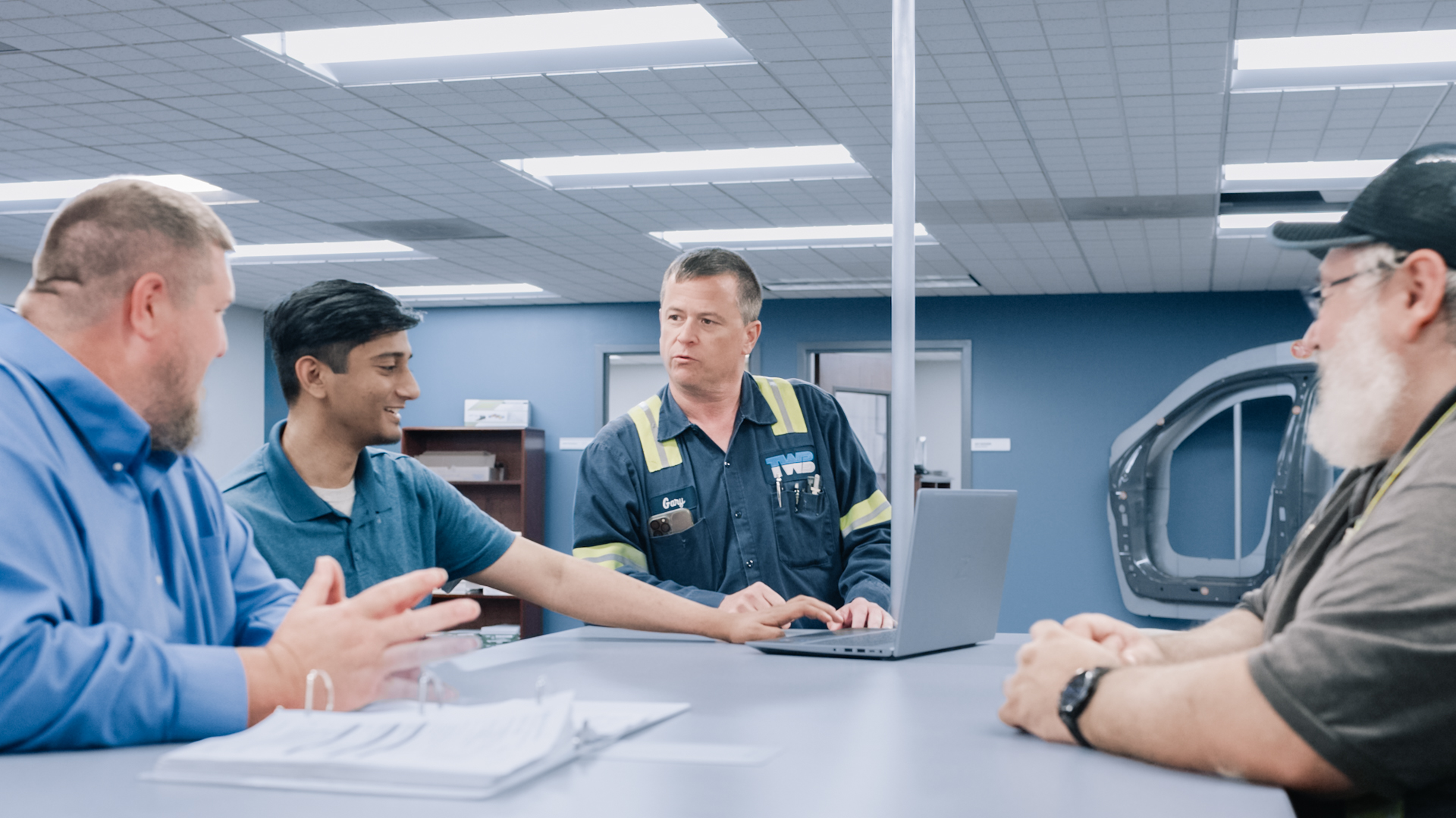 TWB Company employees in a meeting.