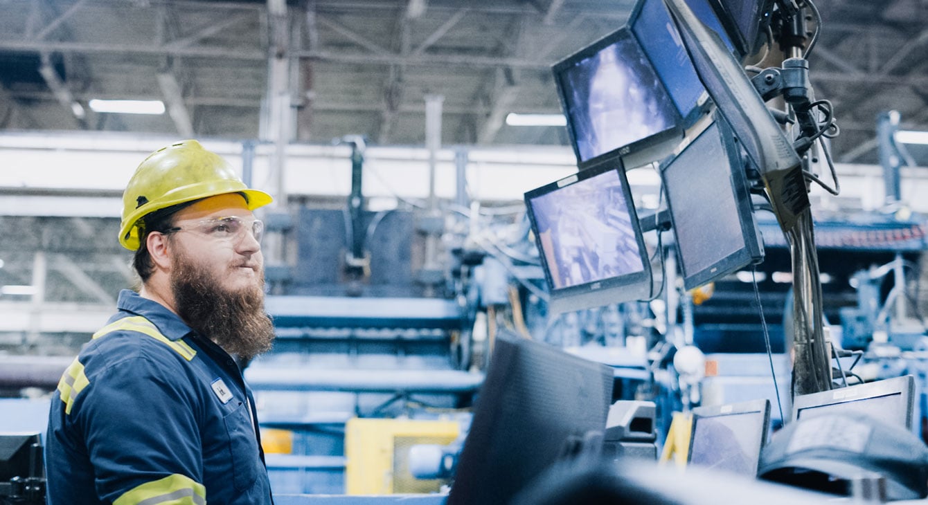 Employer watching monitor screens